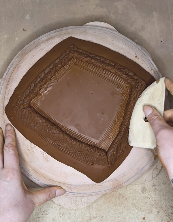 8 Using a rib, compress the strips into the slab, adding definition to the foot.