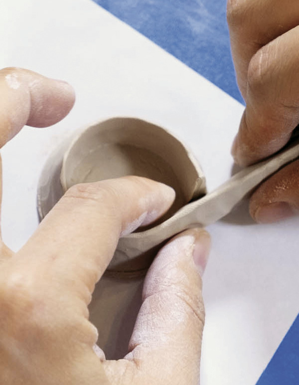 4 Score the coil on the thick edge, score the base slab, attach the coil to the base.