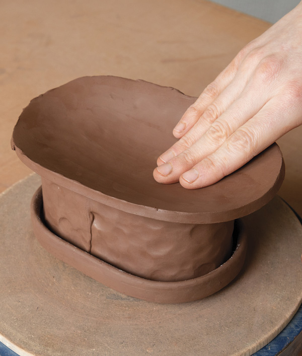 11 Place the lid wall onto the base and gently manipulate the form to fit evenly over the base.