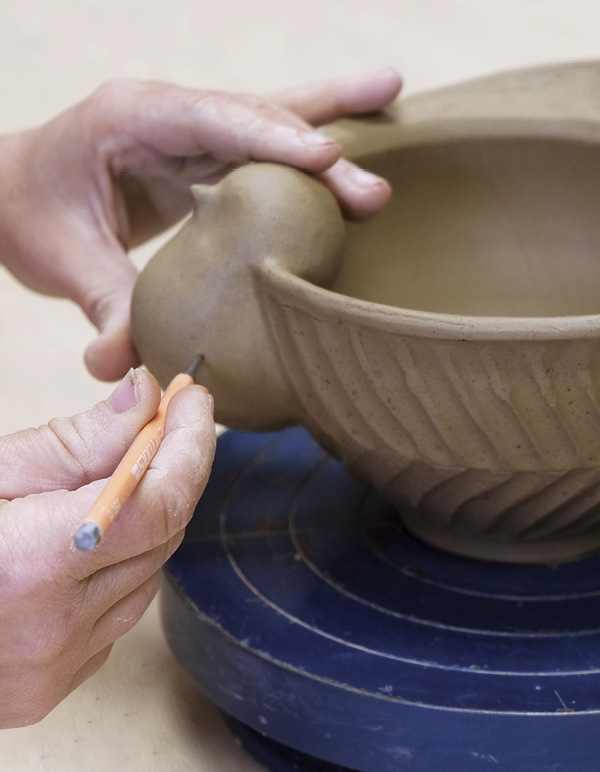 15 Poke a hole in the neck to allow steam to escape during bisque firing.